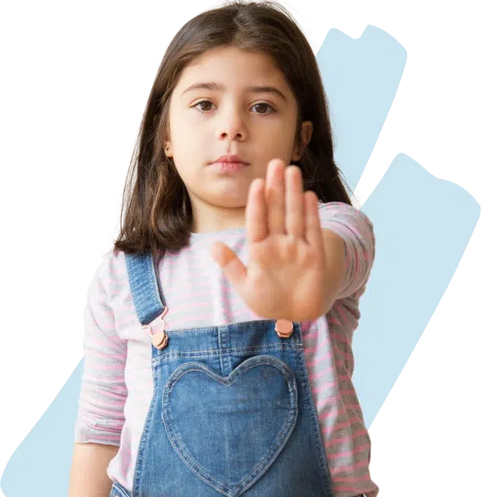 Young girl showing with her hand to stop