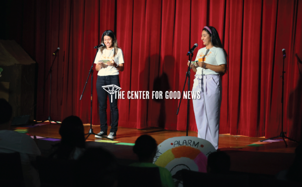 vanessa and africa staff announcing summer theater on stage