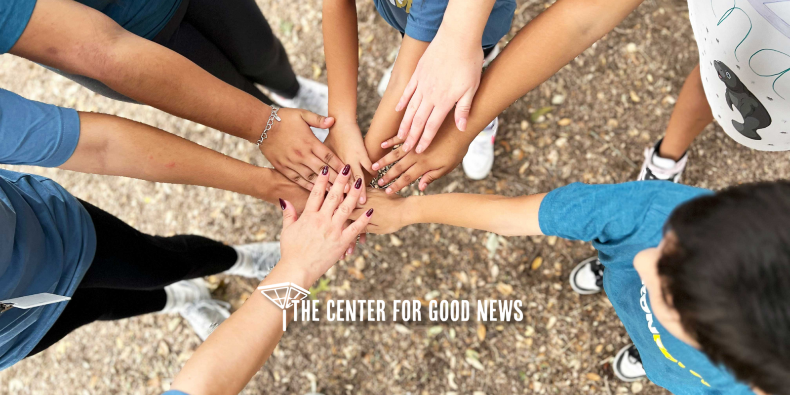 all hands in huddle iron paws center for child protection adventure course