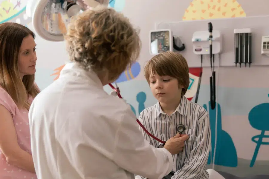 Medical video, kid getting checked by doctor