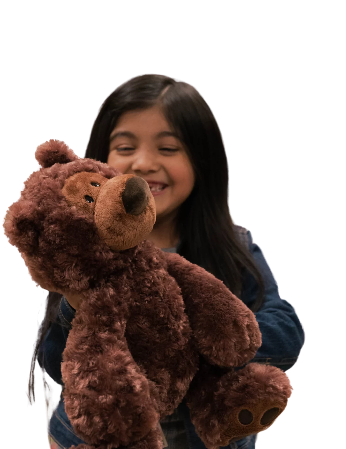 Girl playing with teddy bear